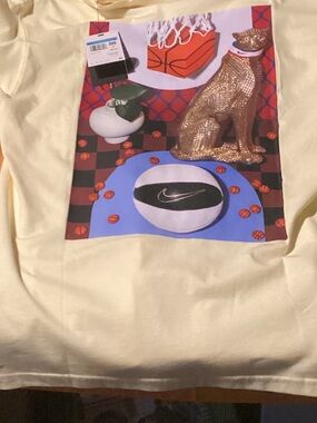 Nike Pale Yellow Graphic Tee with Colorful Basketball Print